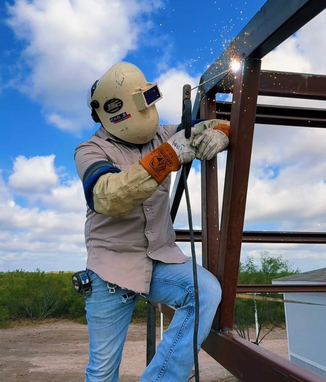 Professional steel fabrication worker demonstrating welding expertise